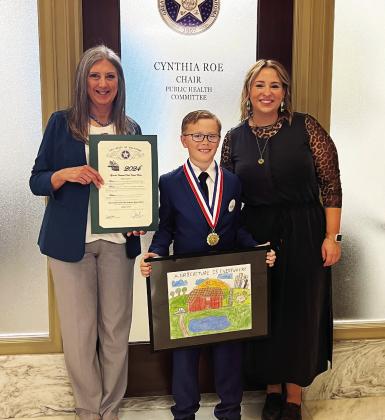 Rep. Cynthia Roe, Adam Lyons and Tania Wren at the Oklahoma State Capitol, where Lyons was recognized for winning his category in the 2024 Ag in the Classroom Contest. Courtesy photo